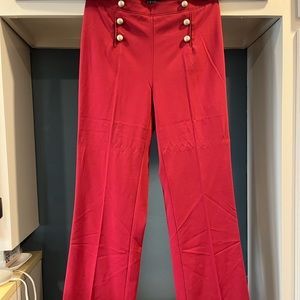 Selling dressy red pants with gold button down designs. From Venus size 8